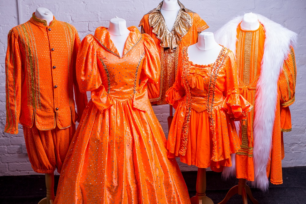 orange panto theme costume hire